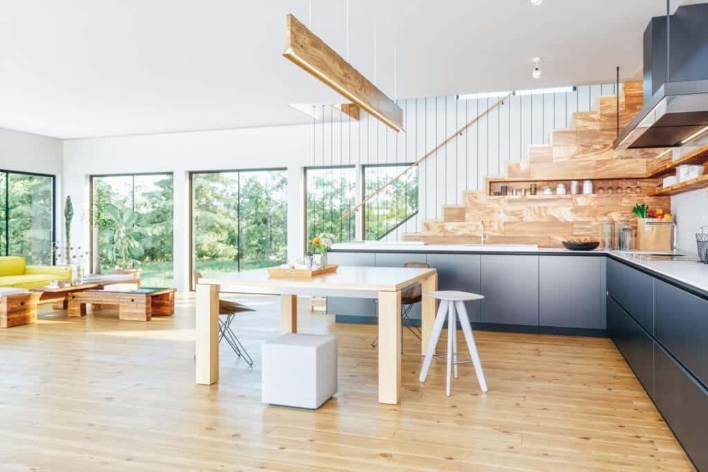Pendant lights cast light on the wooden dining set