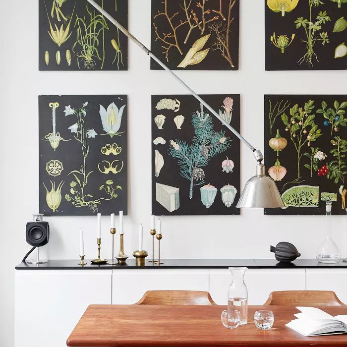 Artwork arranged in multiples in Scandi dining room