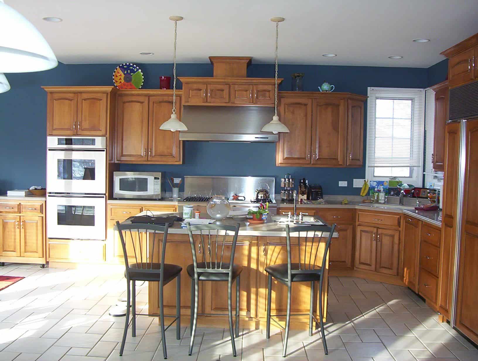 blue kitchen wall with oak cabinet behr