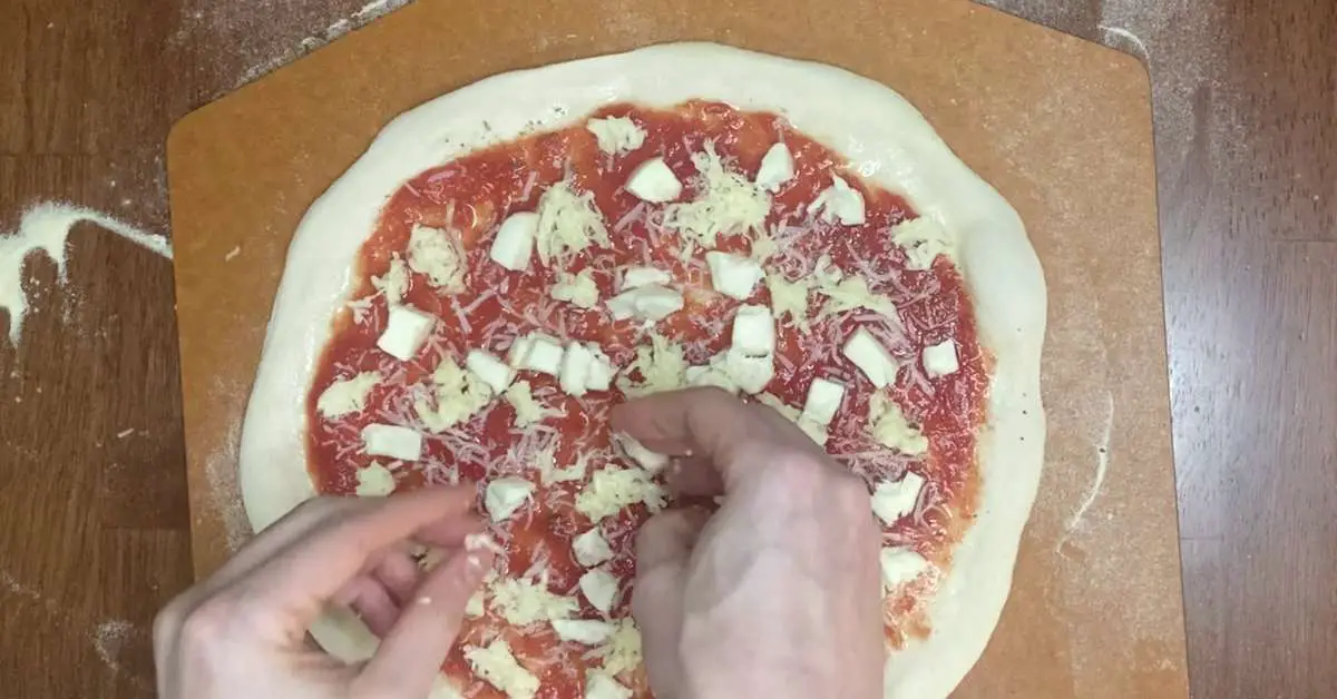 topping-pizza-on-pizza-peel